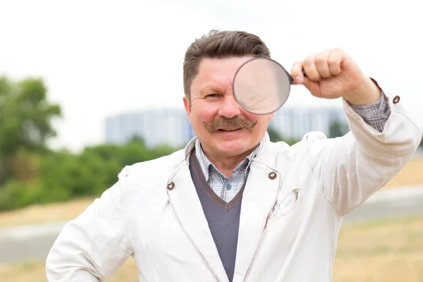 Adult Middle Aged Man Mustache Looks Magnifying Glass — Stock Photo, Image