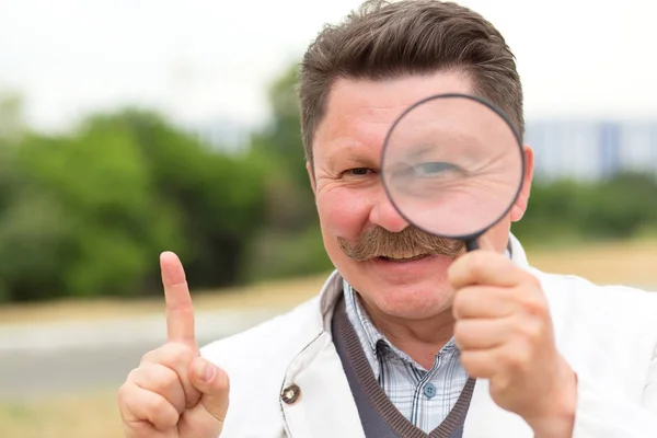 Adult Middle Aged Man Mustache Looks Magnifying Glass — Stock Photo, Image