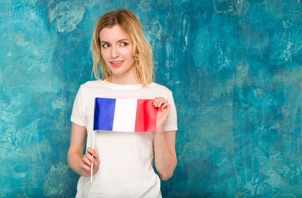 Happy Blond Woman Flag France Blue Wall Background — Stock Photo, Image