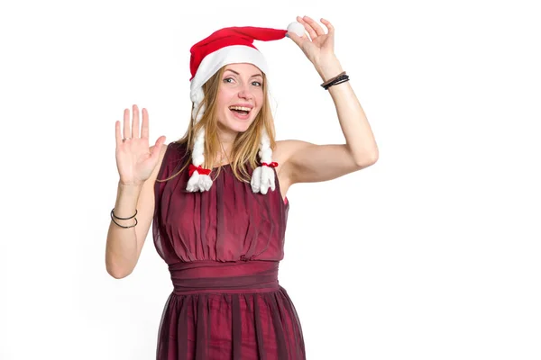 こんにちは サンタ クロースの帽子の陽気な若い女性は 本の指または挨拶の印を示しています クリスマス 新年割引 — ストック写真