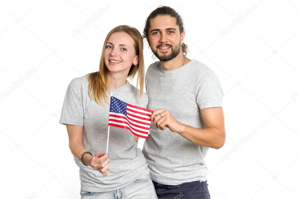 Happy couple with usa flag. A man and a woman are Americans.