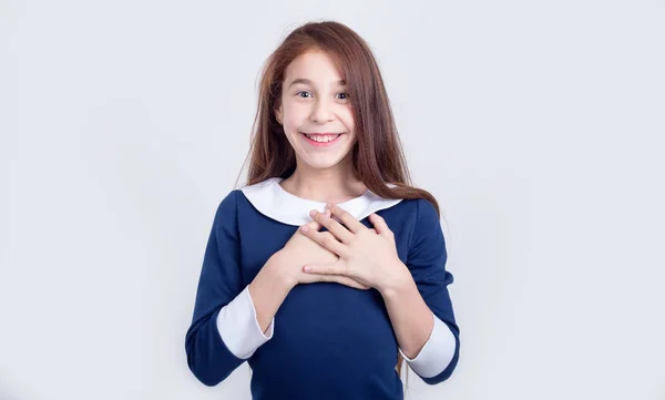 Happy Girl Holds Hands Chest Delight Schoolgirl Joy Standing Light — Stock Photo, Image