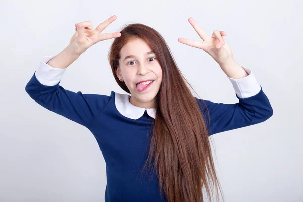 Portrait Cheerful Girl Who Shows Tongue Fingers Sign Light Background — Stock Photo, Image