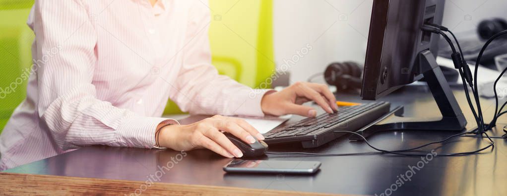 Close up female hands. Woman using computer - concept.