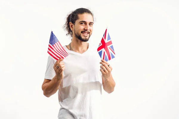 Young Man Two Flags Usa Standing Light Background Learn English — Stock Photo, Image