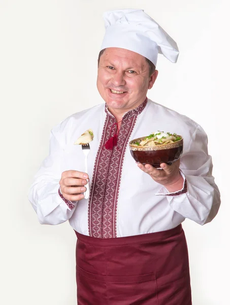 Σεφ Κρατά Νόστιμα Ζυμαρικά Στα Χέρια Του Μάγειρας Άνθρωπος Σλαβικά — Φωτογραφία Αρχείου