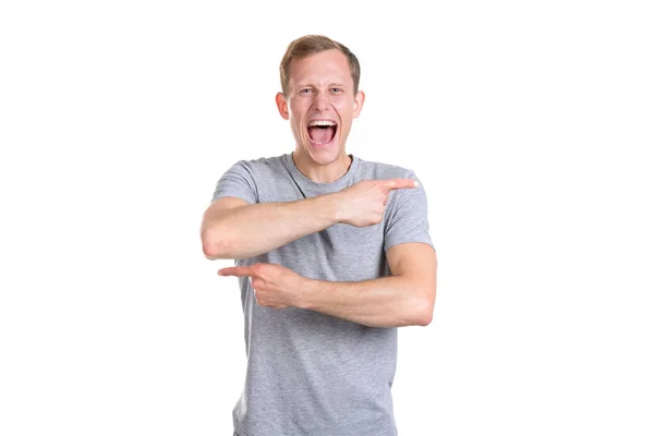 Young Man Gray Shirt Screams Points His Fingers Different Directions — Stock Photo, Image