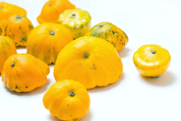 Yellow squash vegetable. Group pattypan squashes, on white table background.