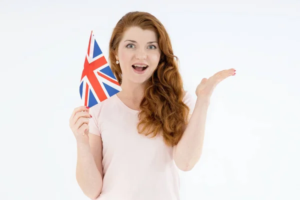 Happy Red Hair Woman Flag United Kingdom Points Her Hand — Φωτογραφία Αρχείου