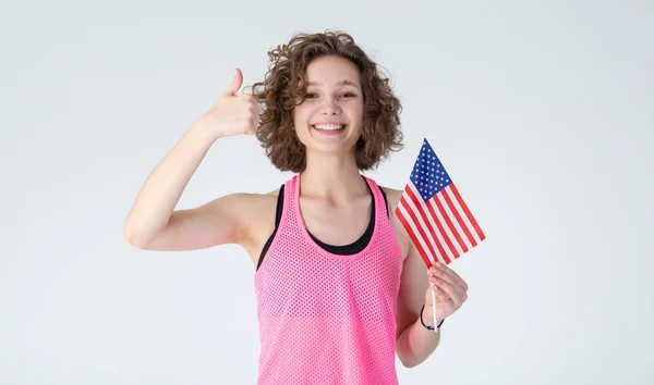 Sports Woman Fitness Clothes Usa Flag Shows Thumb Light Background — Stock Photo, Image