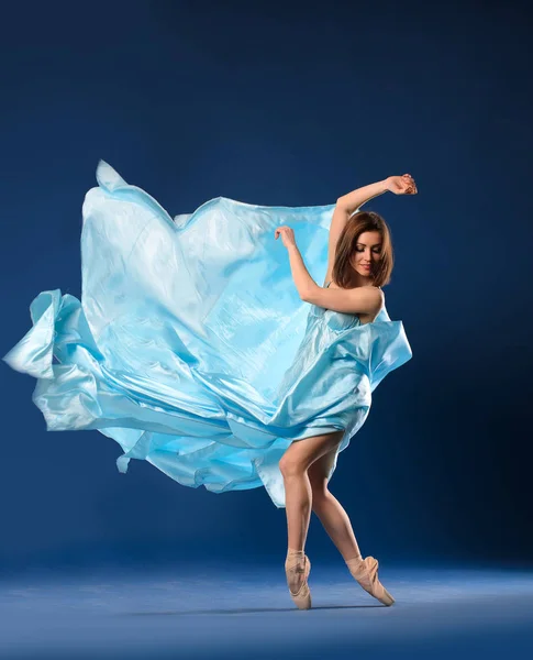 Ballerina Flying Blue Dress Blue Background — Stock Photo, Image