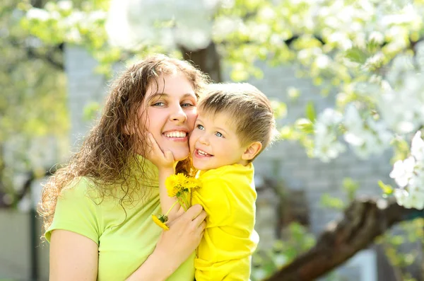 Happy Smiling Little Boy Arms His Mother Lush Spring Garden — Stock Photo, Image