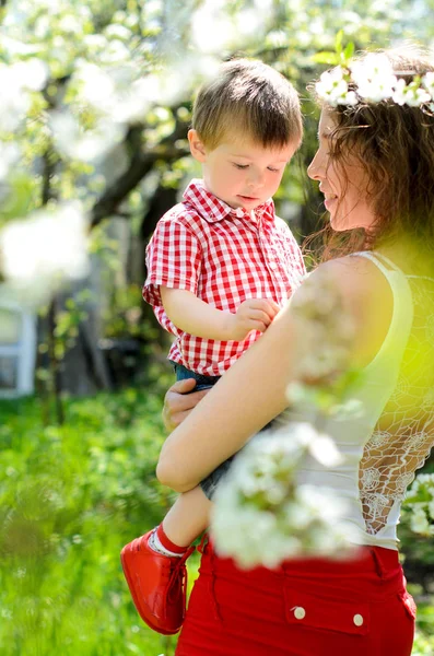 Little Boy Hands Her Mother Lush Spring Garden Apple — Stock Photo, Image