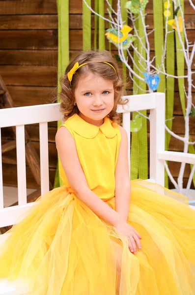 Girl Yellow Dress Sitting White Bench Day Easter Sunday — Stock Photo, Image