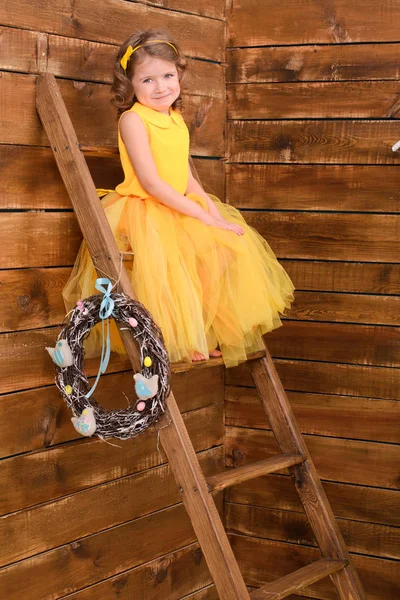 Girl Yellow Dress Sits Stairs Day Catholic Easter — Stock Photo, Image