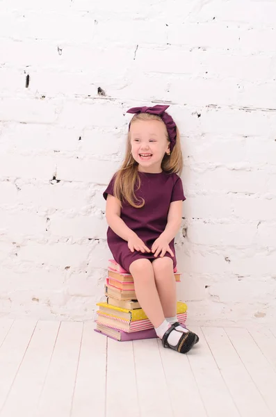 Blond Girl Sitting Pile Books White Brick Wall — Stock Photo, Image