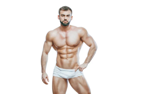 Bodybuilder posant. Beau sportif homme puissance masculine. Lingerie blanche manin musclée fitness. sur fond blanc isolé . — Photo
