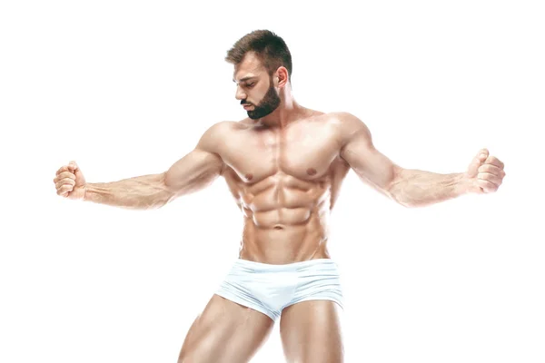 Bodybuilder posing. Beautiful sporty guy male power. Fitness muscled manin white lingerie. on isolated white background. — Stock Photo, Image