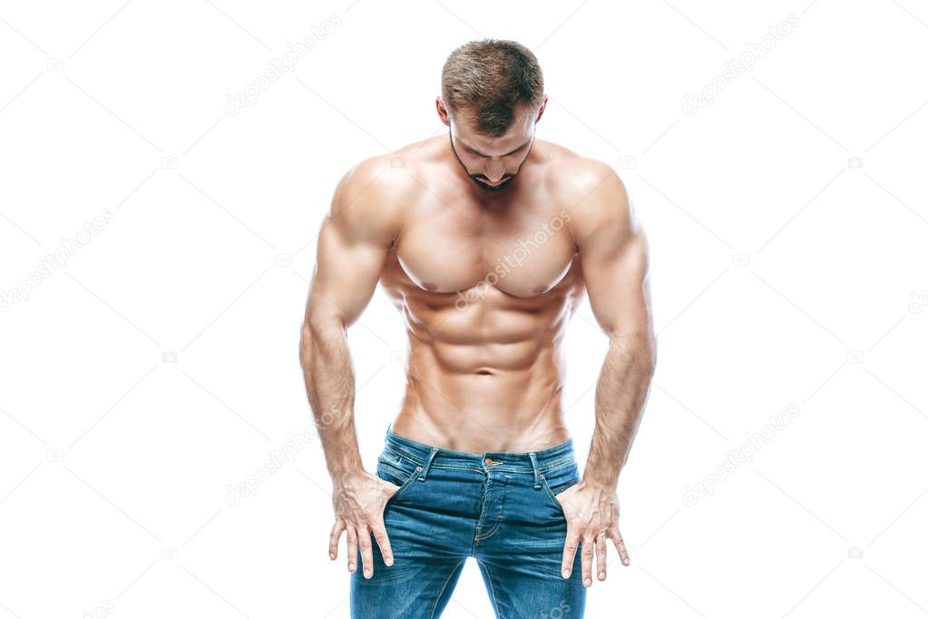 bodybuilder posing. Beautiful sporty guy male power. Fitness muscled in blue jeans. on isolated white background