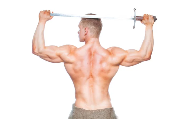 Bodybuilder man posing with a sword isolated on white background. Serious shirtless man demonstrating his mascular body. sword for head — Stock Photo, Image