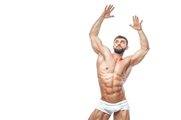 Fisiculturista posando. Bonito desportista poder masculino. Fitness muscled manin lingerie branca. sobre fundo branco isolado . — Fotografia de Stock