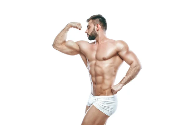 Fisiculturista posando. Bonito desportista poder masculino. Fitness muscled manin lingerie branca. sobre fundo branco isolado . — Fotografia de Stock