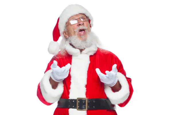 Christmas. Good Santa Claus in white gloves shows faces, grimaces, shows his tongue. Not standard behavior. Isolated on white background. — Stock Photo, Image