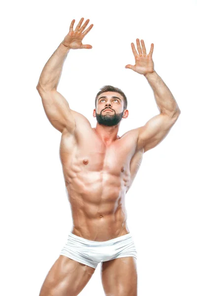Kroppsbyggare poserar. Vacker sportig kille manlig makt. Konditionen muskulös manin vita underkläder. på isolerade vit bakgrund. — Stockfoto