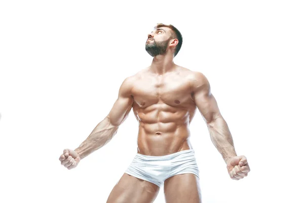 Fisiculturista posando. Bonito desportista poder masculino. Fitness muscled manin lingerie branca. sobre fundo branco isolado . — Fotografia de Stock