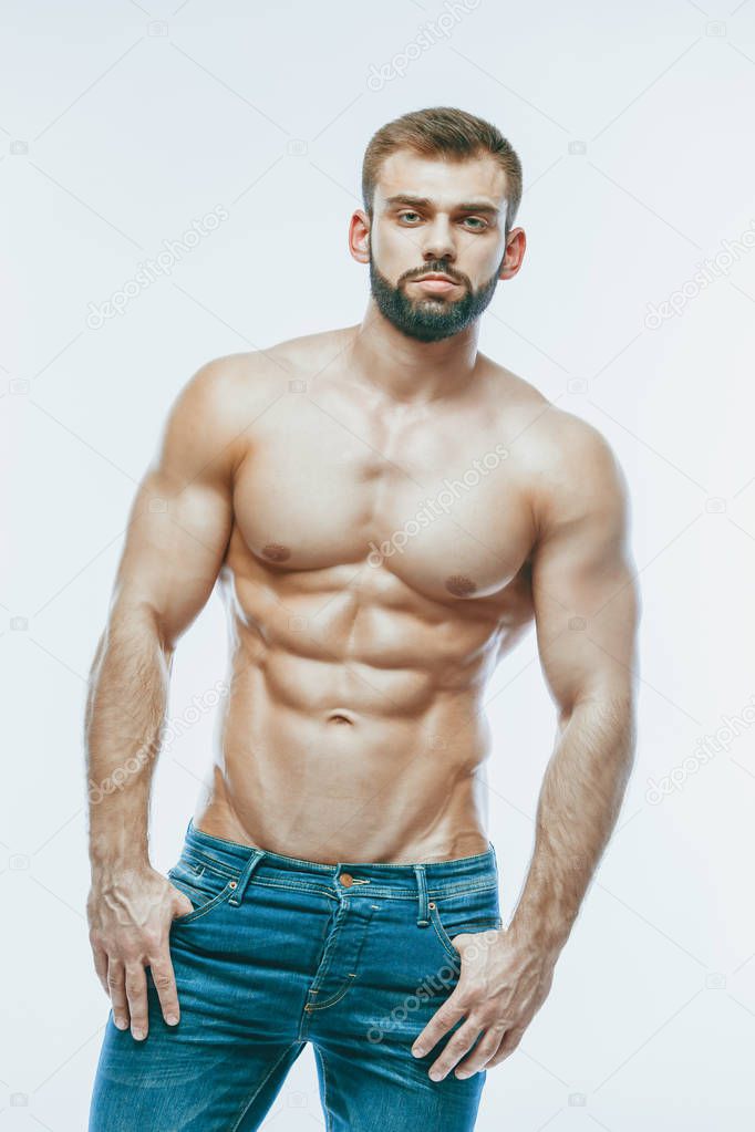 bodybuilder posing. Beautiful sporty guy male power. Fitness mus