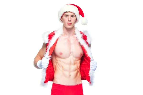 Pai Natal sexy. Jovem homem musculoso usando chapéu de Papai Noel demonstrar seus músculos. Isolado sobre fundo branco. — Fotografia de Stock