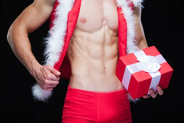 Santa Claus. Fitness Santa Claus na białym na czarnym tle. Sexy fitness santa claus. Muskularny Święty Mikołaj z giftboxes — Zdjęcie stockowe