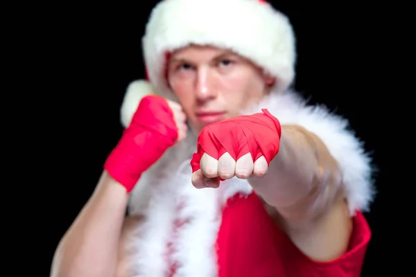 Christmas. Muscular Fighter kickbox boxing Santa Claus With Red Bandages isolated on black background. — Stock Photo, Image