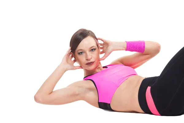 Een vrouw uitoefening workout fitness aërobe oefening abdominale push ups houding op studio geïsoleerd witte achtergrond. — Stockfoto
