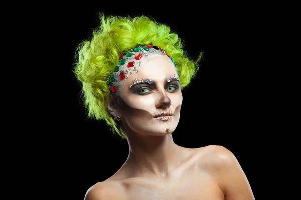 Halloween. Portrait of young beautiful girl with make-up skeleton on her face. And green hair. Isolated on black background. — Stock Photo, Image