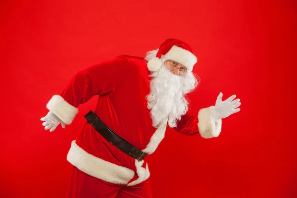 Christmas. Running Santa Claus red background Merry Christmas. — Stock Photo, Image