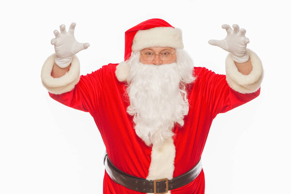 Shocked Santa Claus raising his hands scares, isolated on white 