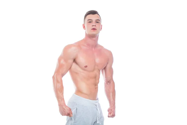 Starker athletischer Mann Fitness-Modell Oberkörper zeigt Sixpack Bauchmuskeln. isoliert auf weißem Hintergrund mit Copyspace — Stockfoto