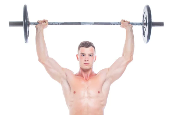 Hombre musculoso ejercitándose en el estudio haciendo ejercicios con barra en bíceps, fuertes abdominales masculinos desnudos del torso. Aislado sobre fondo blanco. Copiar espacio . — Foto de Stock