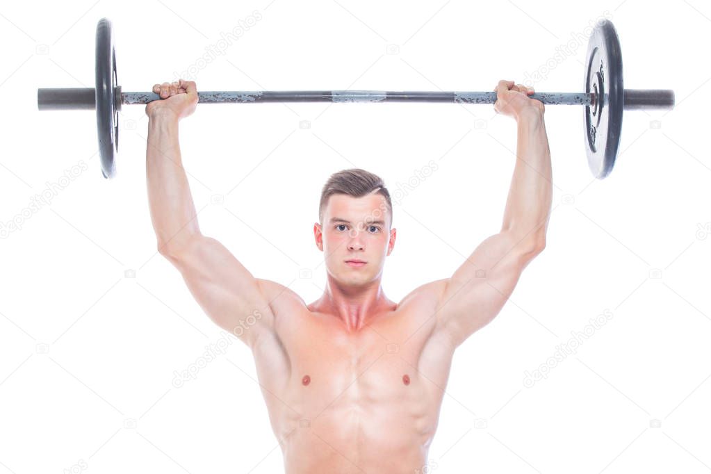 Muscular man working out in studio doing exercises with barbell at biceps, strong male naked torso abs. Isolated on white background. Copy Space.