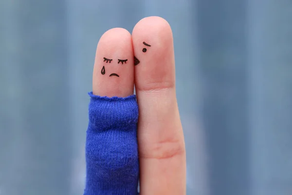 Fingers art of displeased couple. Pregnant cries, man reassures her. He kisses and hugs her.