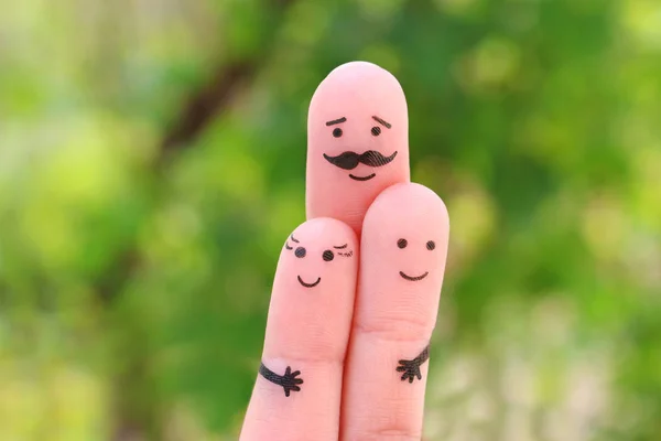 Fingers art of happy family. Concept father hugs children.