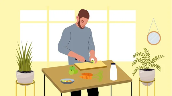 Hombre guapo cocinando, cortando manzanas, zanahorias con un cuchillo. concepto de vegetarianismo, comida saludable. El hombre cuida de su salud. Mesa de cocina, tabla de cortar, verduras, ensaladera, frutas, botella de leche. — Vector de stock