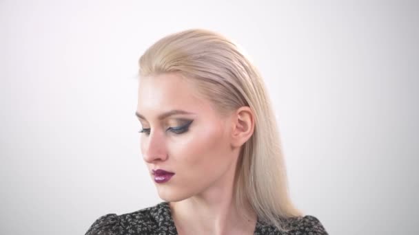 Beautiful young blonde with bright makeup. with purple lipstick. — Stock Video