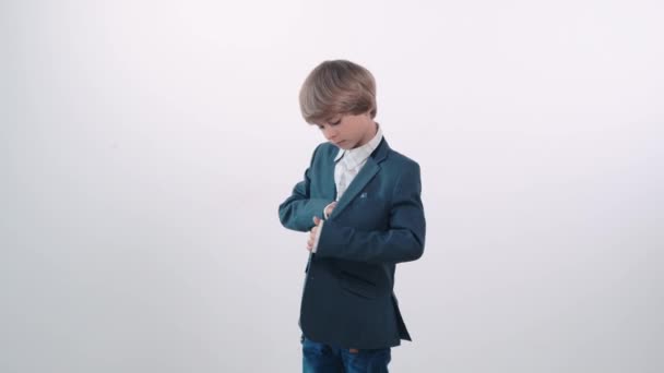 A contented boy takes a bank card from his pocket and shows a thumbs up gesture — Stock Video