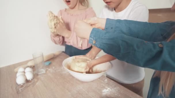 Children learn to cook cookies, mix the dough with a silicone spoon. — Stock Video