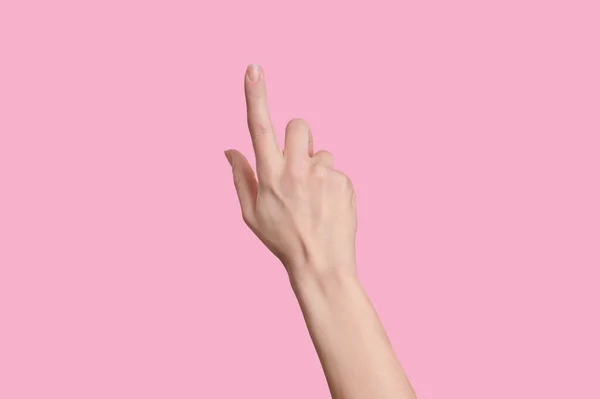 Isolerad kvinnlig lätt hand som rör vid eller pekar på något. Isolerad. — Stockfoto
