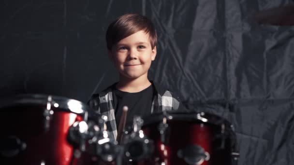 Pleased brunette boy rehearsing before the concert. Drumming. — Stock Video