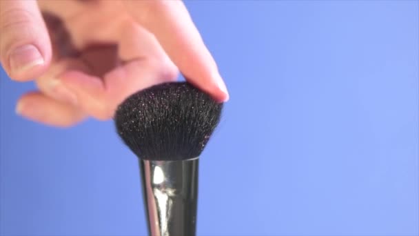 Close-up time lapse shot of a wide, fluffy cosmetic brush. — Stock Video