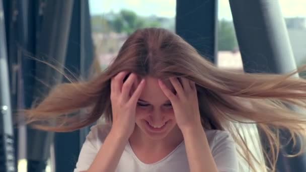 Blonde girl. Time-lapse shot of blond hair developing in the wind. — Stock Video